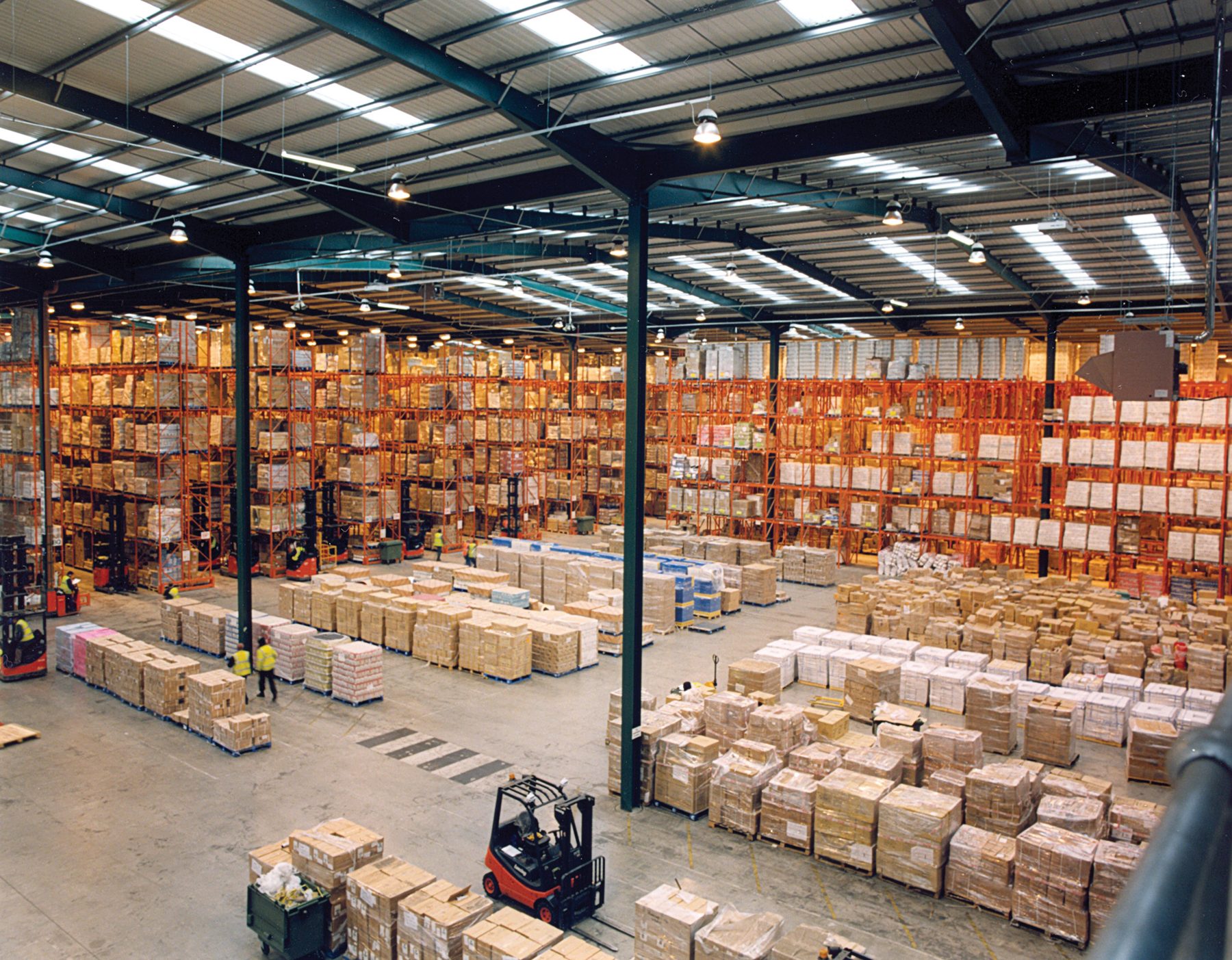 Warehouse with pallet racks and stacked cartons